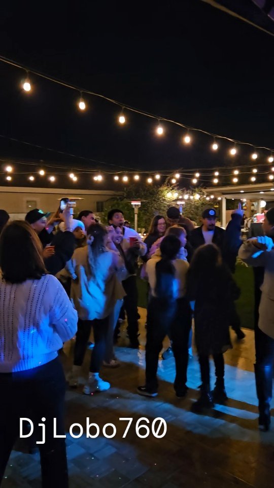 Guests dancing at an outdoor DJ Lobo event