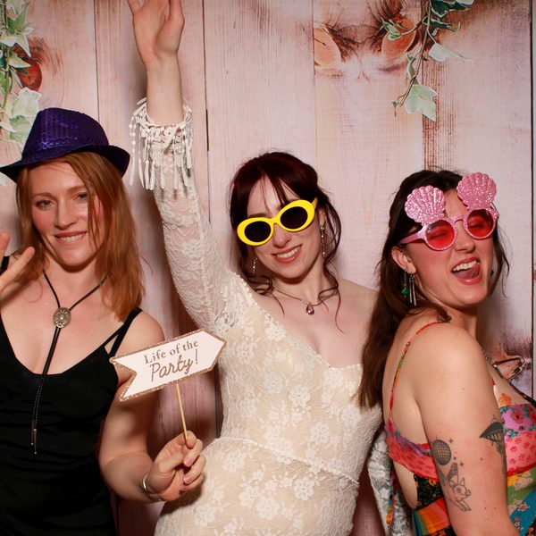 Friends posing for a photo booth strip